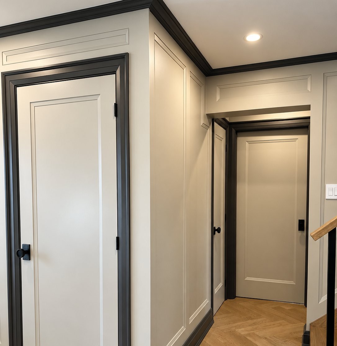 Hallway with freshly painted doors, trim and wall panelling in an Etobicoke home