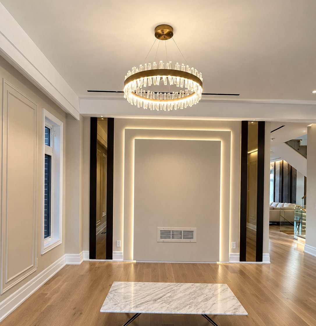 Living room with painted panel moulding and crown detail in an Oakville home