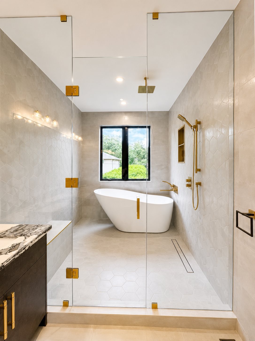 Master bathroom with freshly painted walls, a glass shower and a freestanding tub