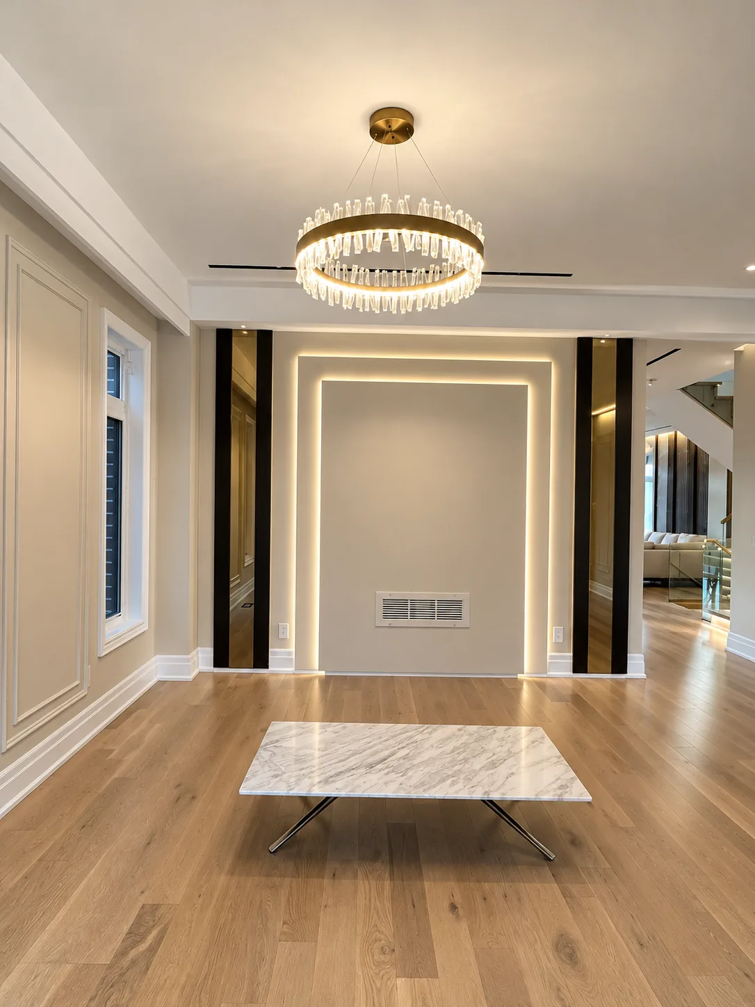Living room with painted wall panel moulding and an LED-lit feature wall