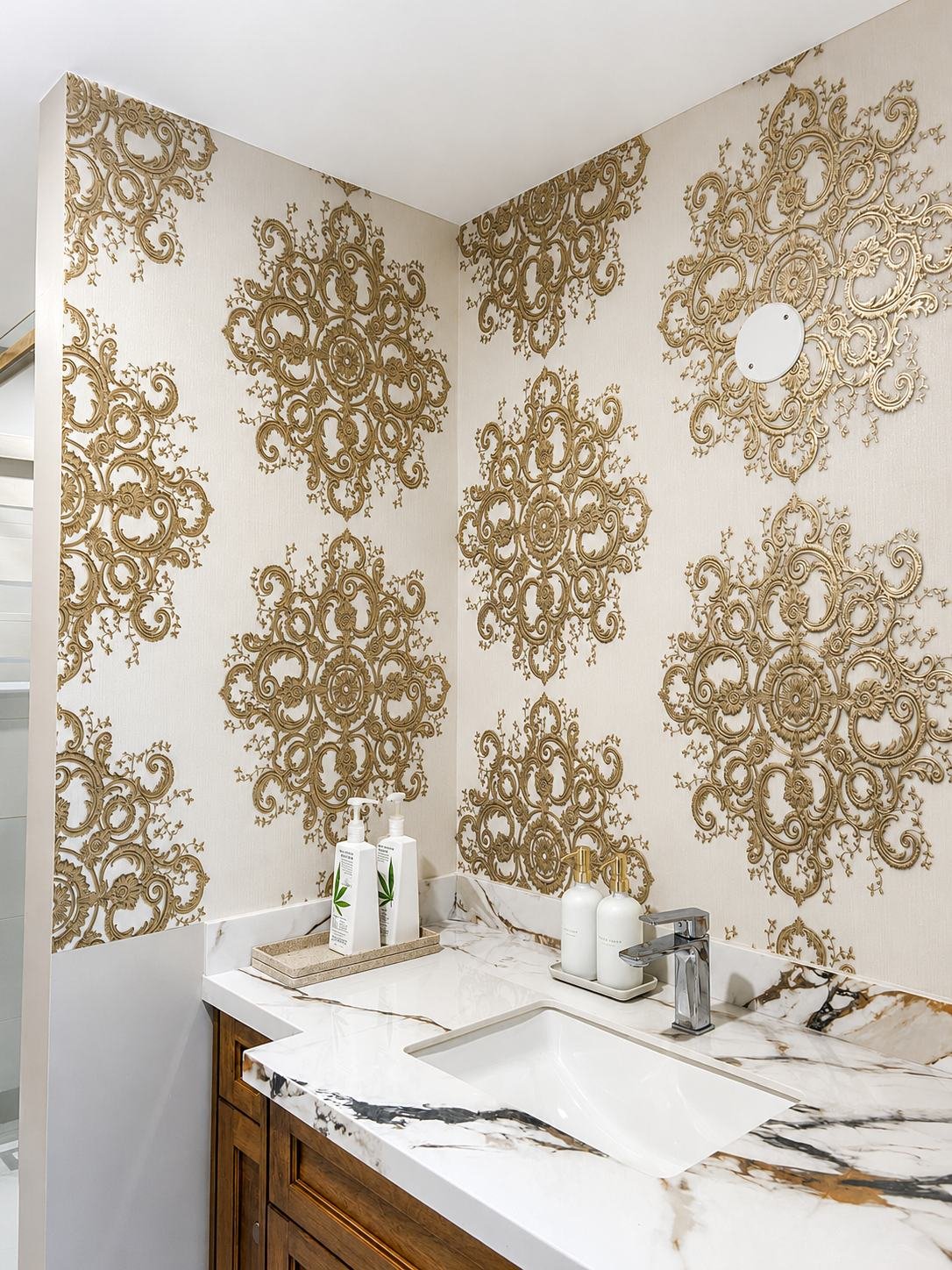 Powder room with large gold damask wallpaper and matched pattern seams