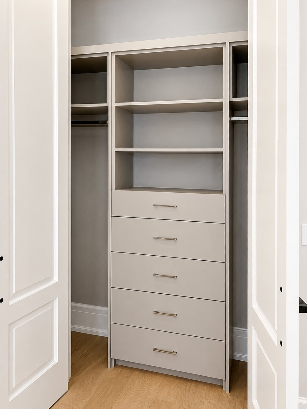 Spray-finished grey built-in closet shelving and drawers