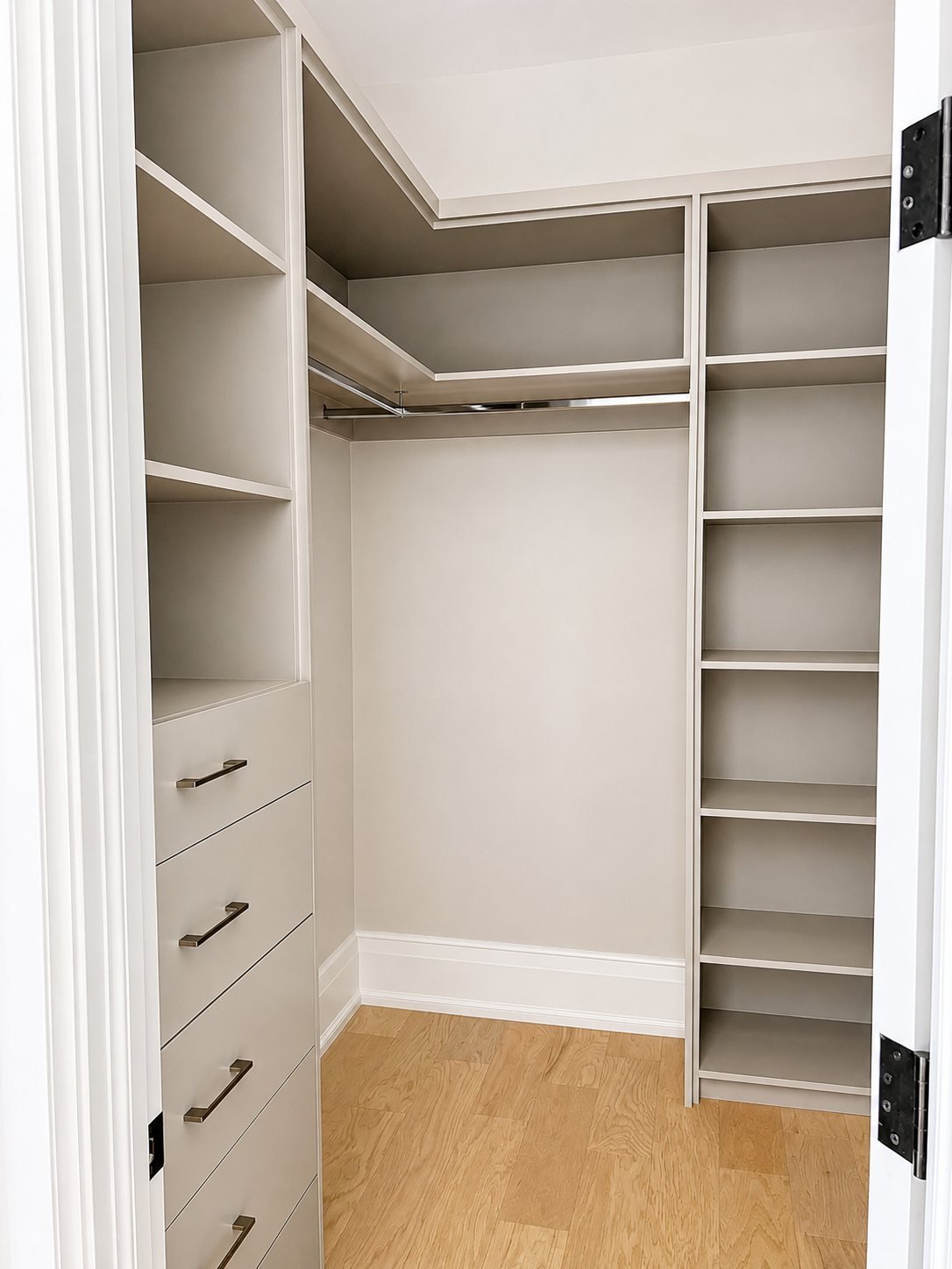 Spray-finished grey built-in closet shelving and drawers, corner view