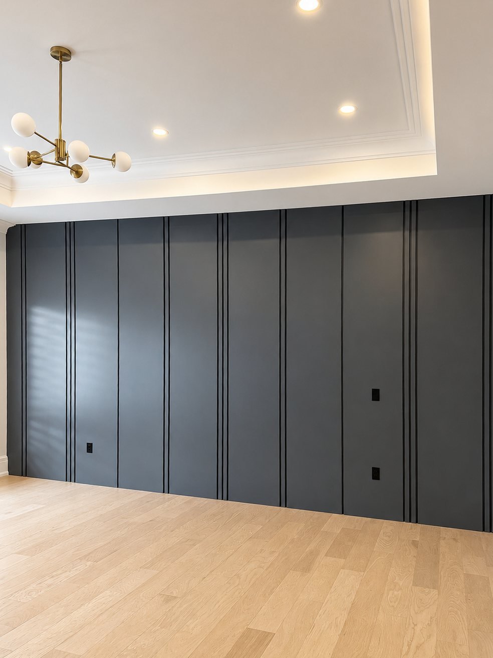 Spray-finished charcoal vertical wood wall panels in a living room
